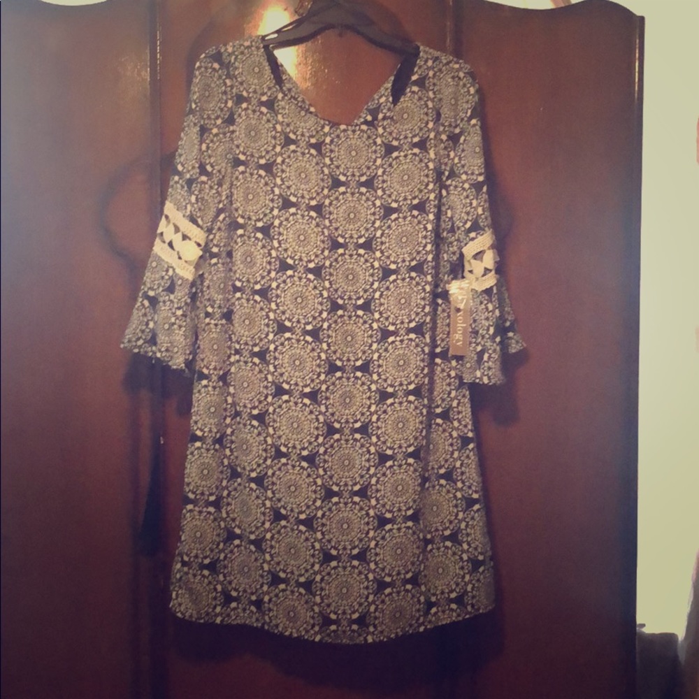 A Must have dress!! Mid thigh just above the knee!
